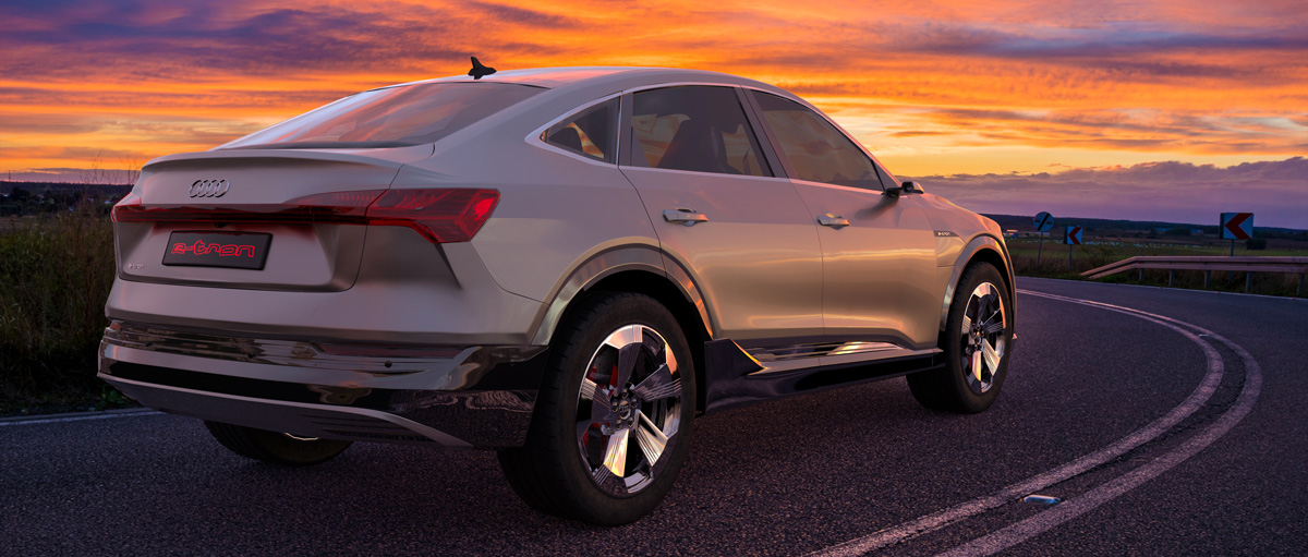 Une Audi e-tron sportback roule au soleil couchant avec un superbe ciel
